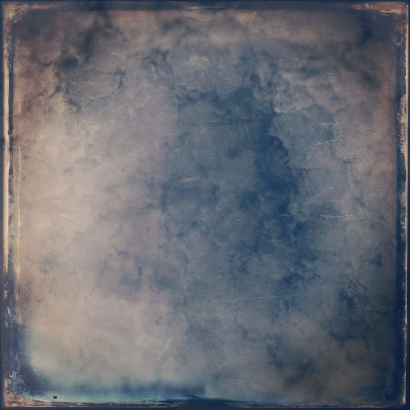 A worn, tinted surface of blue and sand, like clouds, a third tint